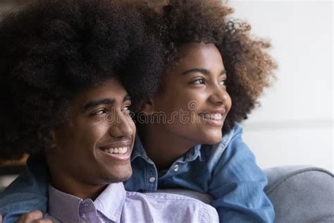 Closeup Faces Of Beautiful African Teenagers Couple Look Into Distance