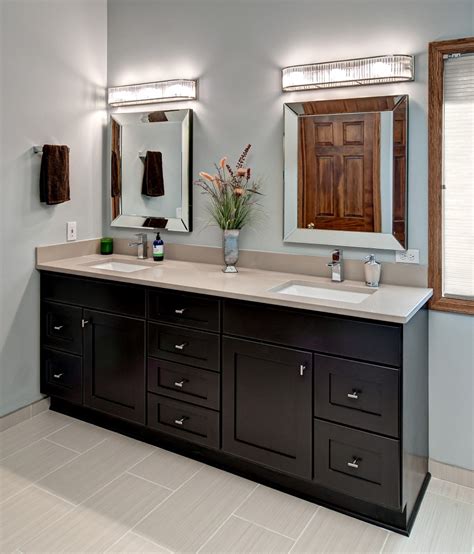 Meanwhile, the yellow bathtub walls, medium brown bathroom cabinets, and gray painted walls all come together the bathroom vanity cabinet is dark wood topped with pale quartz tile and a striped backsplash made of subway tile. Simple but Charming Bathroom Renovation Ideas - Amaza Design
