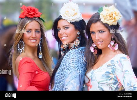 Three Girls In Traditional Dress During The Sevilla Fair Spain Stock