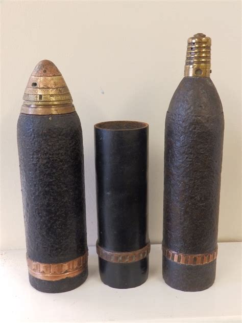 A Wwi French 75mm Shrapnel Shell With Beehive Fuse A British 18