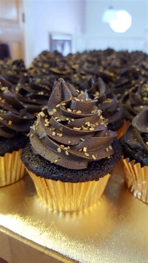 Chocolate Cupcake With Dark Chocolate Buttercream And Gold Sprinkles