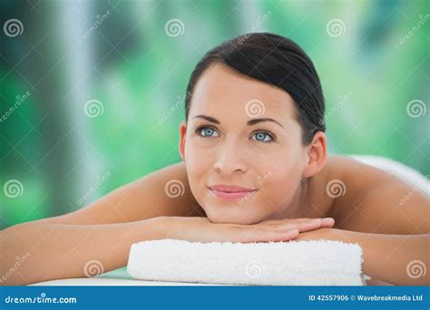 Beautiful Brunette Relaxing On Massage Table Smiling Stock Photo Image Of Front Female