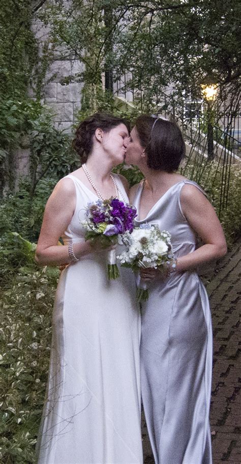two brides kissing in the garden chase court baltimore maryland wedding and event venue