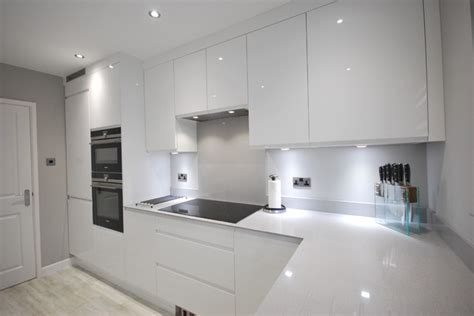 Granite is the most popular stone for worktops and gives a quality feel to kitchens. White gloss j-pull contemporary kitchen with light grey ...