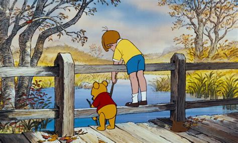 Image Christopher Robin And Pooh Bear Are Both On A Bridge