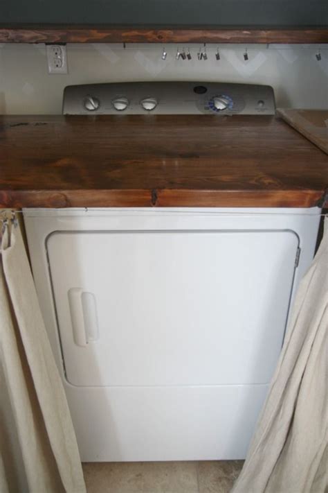 Any ideas for me on how i can hide/ cover this stacked washer & dryer? OMG! I've been thinking about doing this! Adding a wood ...
