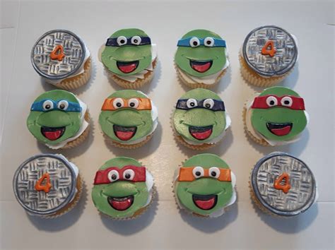 Twelve Cupcakes Decorated To Look Like The Teenage Mutant Ninja Turtles