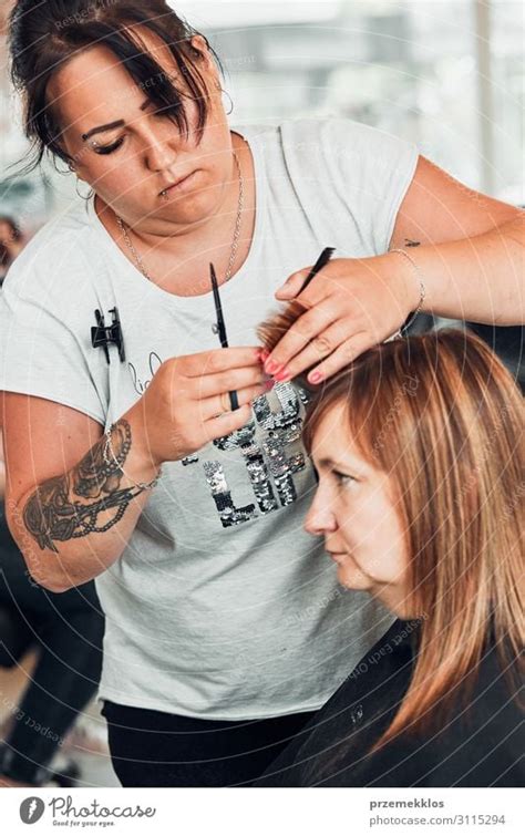 Hairdresser Styling Womans Hair A Royalty Free Stock Photo From Photocase