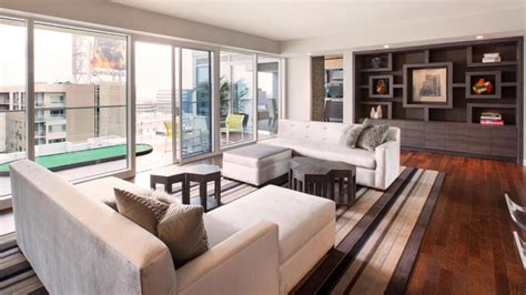 Contemporary White Living Room Features Balcony Access Hgtv