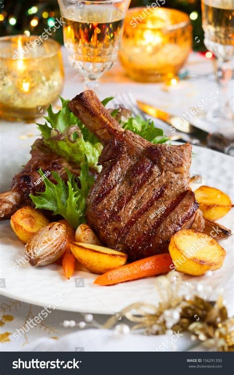 What makes a traditional christmas dinner particularly british? Veal Chop Vegetables Christmas Dinner Stock Photo ...