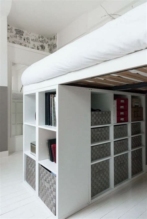 A Loft Bed With Shelves Underneath It And Bookshelves On The Bottom Shelf Below
