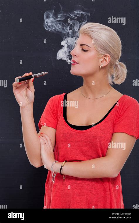 Woman Smoking Cigarette Exhaling Tobacco Hi Res Stock Photography And