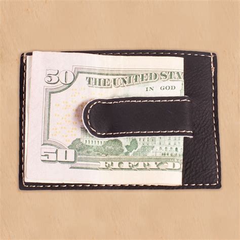 Help him keep his bills and credit cards safe with this stylish accessory. Initial Black Leatherette Engraved Money Clip | GiftsForYouNow