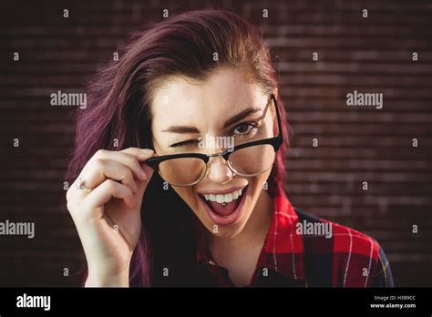 Young Woman Winking Stock Photo Alamy