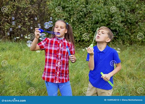 Kids Playing With Bubbles Stock Photo Image Of Happiness 104954010