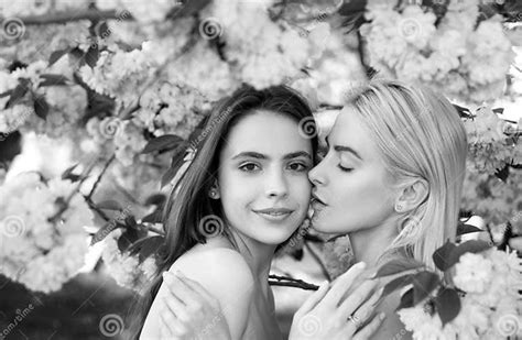 Portrait Of A Two Beautiful Spring Girls Two Young Women Relaxing In Sakura Flowers Lesbian