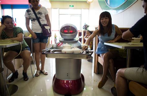 robots cook and serve food at new restaurant in china ctv news