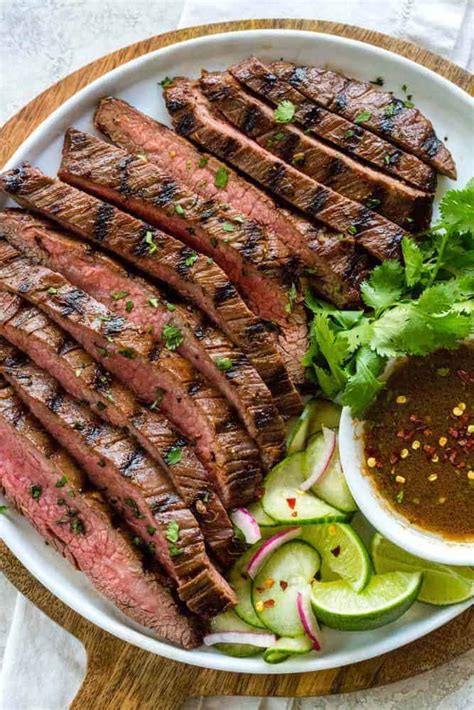 Tender strips of seasoned fajita flank steak with onion and bell peppers, cooked to perfection in the instant pot. Grilled Flank Steak with Asian-Inspired Marinade | The Recipe Critic