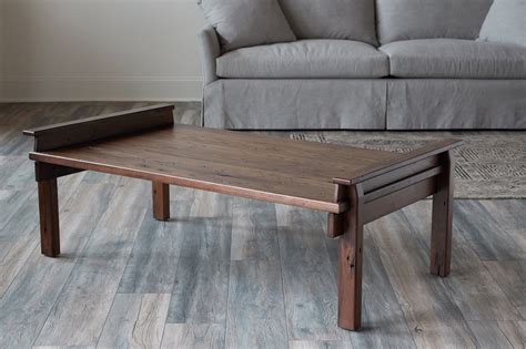 With a danish inspired design, this rounded tabletop is offset by its slim, tapered legs. Creston Coffee Table, Reclaimed Fumed Oak | EJ Victor