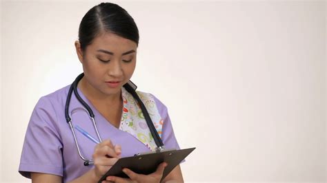 Smiling Asian Nurse With Clipboard Stock Video Footage Storyblocks