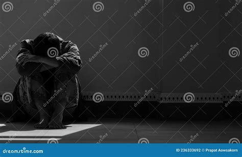 Sunlight And Shadow On Surface Of Hopeless Man Sitting Alone With