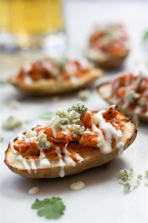 Add 2/3 cup of the dressing and toss well to coat. Buffalo Chicken Stuffed Potato Skins with Honey Blue ...