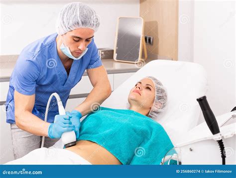 Beautician Performing Rf Lifting Procedure For Female Stock Photo