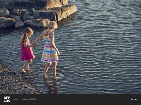 Girls Wading In Lake Offset Stock Photo Offset