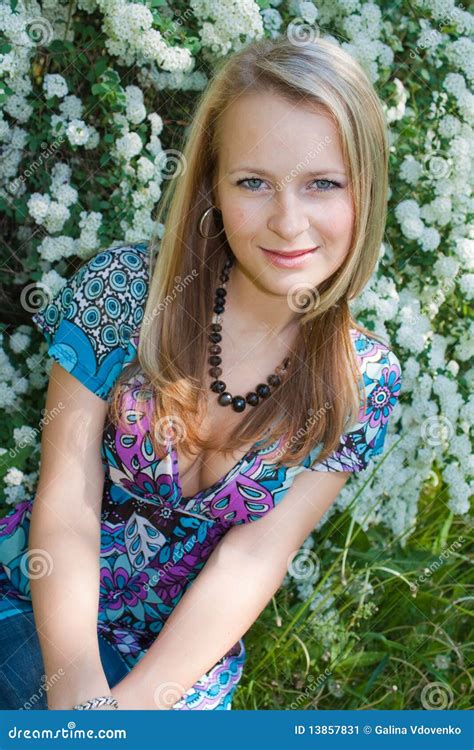 The Fair Haired Girl Sits In A Garden Stock Image Image Of Buds Pretty 13857831