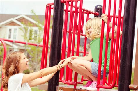 Mother And Daughter At The Playground By Stocksy Contributor Tomas Kraus Stocksy