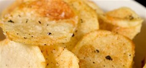 Gently place some potatoes into the hot oil. HowTo: Make Perfect, Extra-Crispy Potato Chips « Snacks ...