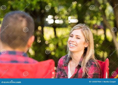 Couple Talking And Laughing On A Camping Trip Stock Photo Image Of