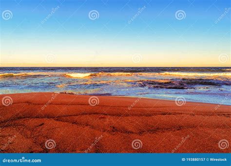 Beach Surrounded By The Sea During A Beautiful Sunrise Perfect For