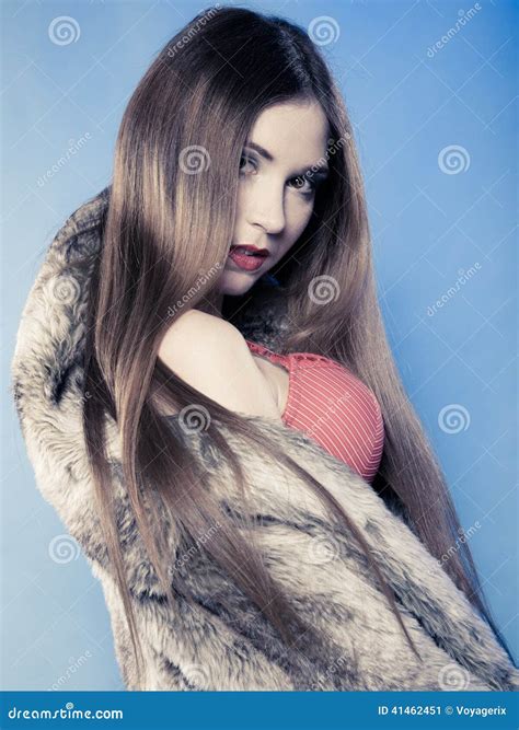 Girl With Long Hair In Red Bra Underwear And Fur Coat On Blue Stock Image Image Of Fashion