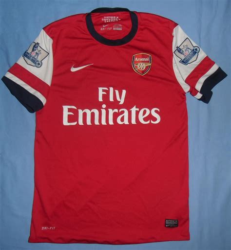 We would like to show you a description here but the site won't allow us. Arsenal Home football shirt 2012 - 2014. Sponsored by Emirates