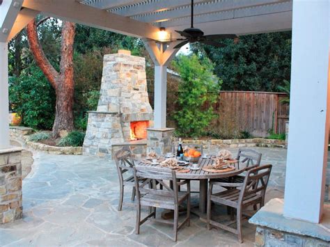 Mediterranean Outdoor Dining Area With Stone Fireplace Hgtv
