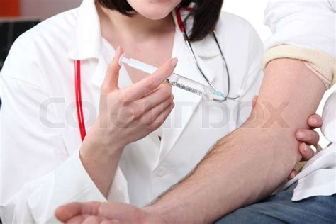 Doctor Giving A Patient An Injection Stock Image Colourbox