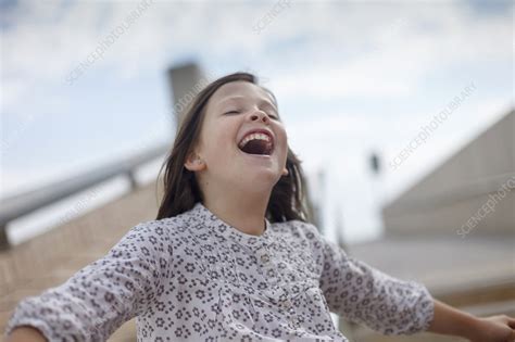 Girl Laughing Outdoors Stock Image F Science Photo Library