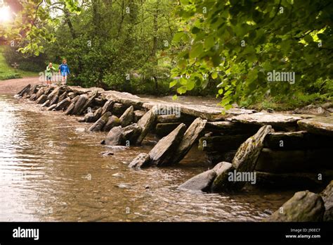 The Tarr Steps Clapper Bridge Across The River Barle In The Exmoor