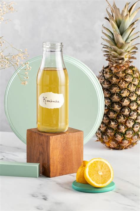 Free Photo Delicious Kombucha Bottle And Pineapple