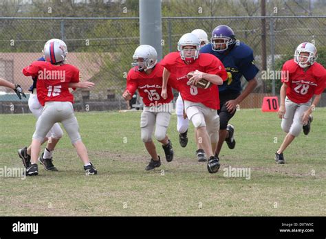 Boys Playing Tackle Football In Austin Texas Stock Photo Alamy