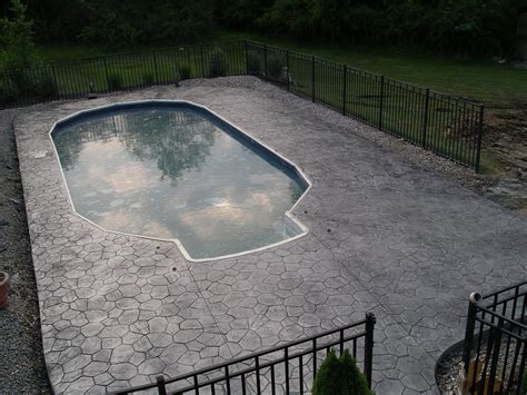 Beautiful Stamped Concrete Deck Surrounds The Luxury Of Your Outdoor Pool Concrete Deck