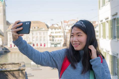 Asian Woman Backpacker Touring In Europe Young Happy And Pretty