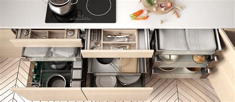 Most kitchen cabinetry sets have a row of drawers for storing supplies that don't belong in the cabinets. How to Organize Kitchen Cabinets and Drawers | Kitchenistic