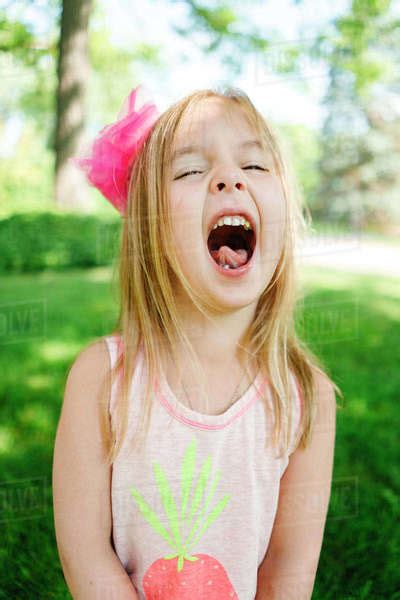 Closeup Portrait Of A Young Girl Laughing Stock Photo Dissolve