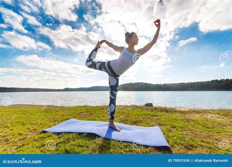 Young Woman Doing Yoga Near Lake Outdoors Meditation Sport Fitness