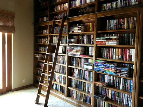 Handmade Built In Library With Rolling Ladder By Paul Rene Furniture