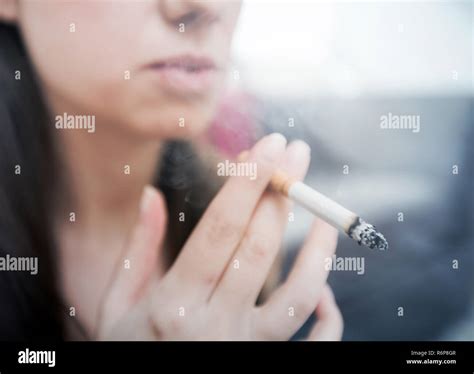 Woman Smoking Cigarette Stock Photo Alamy
