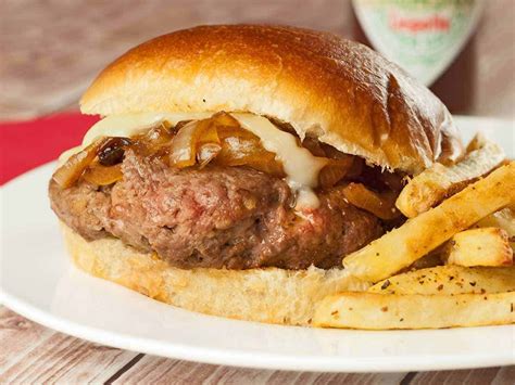 Pan Seared Burgers Seasoned With Cumin And Coriander And Topped With