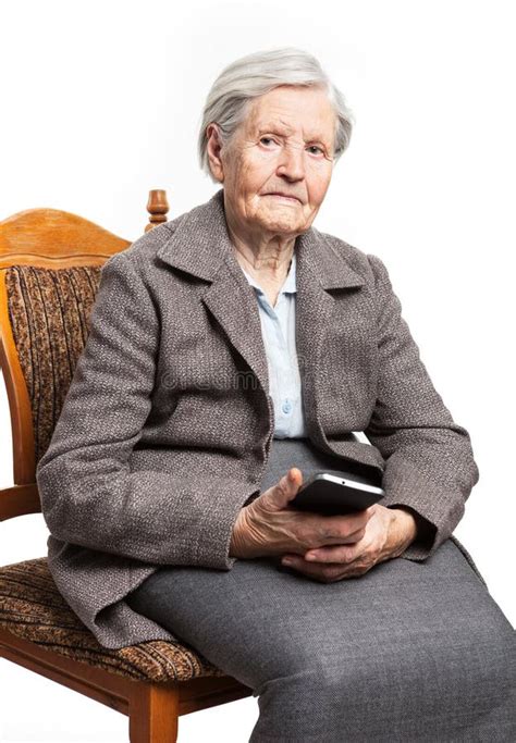 Senior Woman Sitting On Chair And Holding Phone Stock Image Image Of